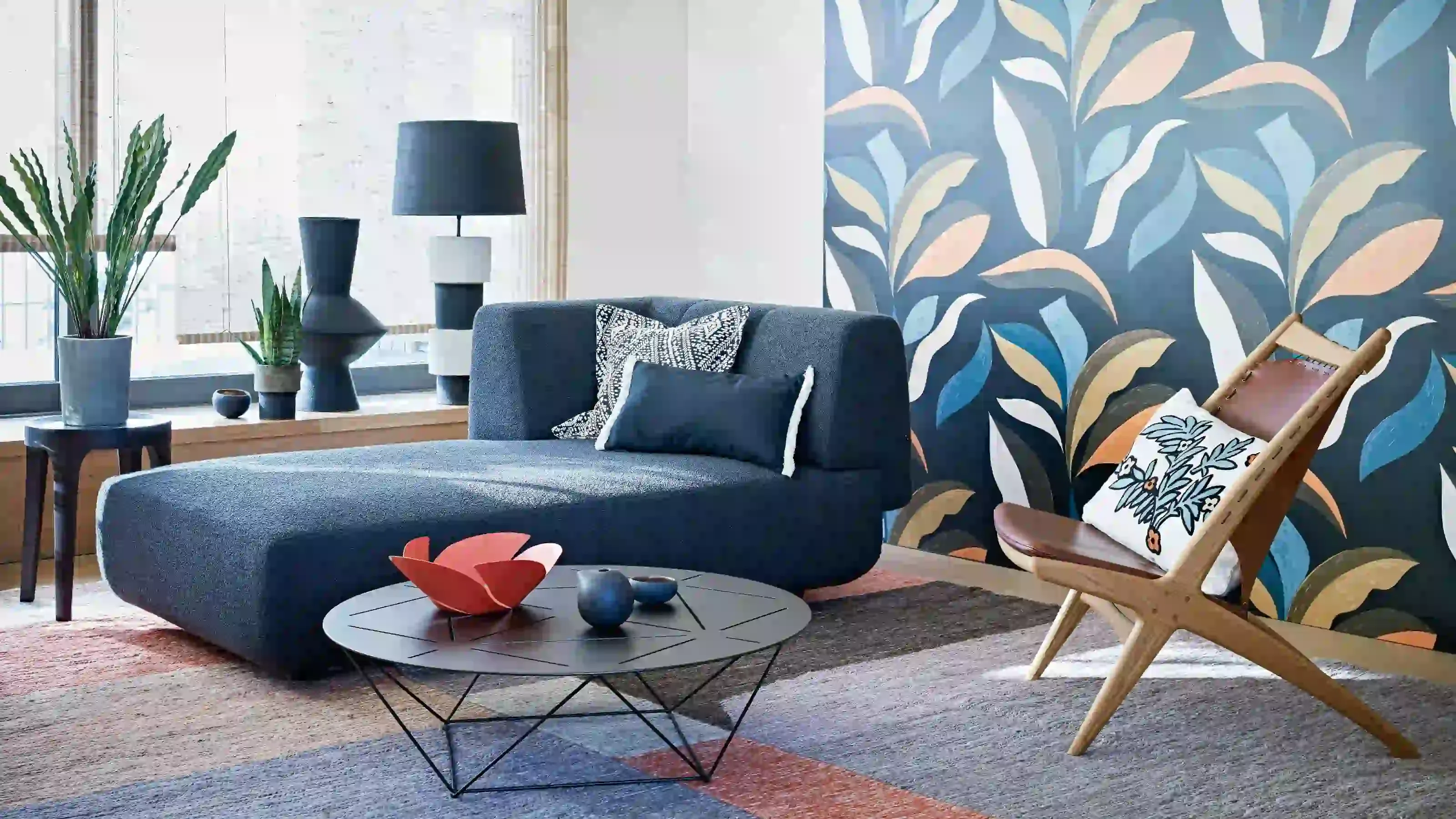 Blue botanical wallpaper in a contemporary sitting room